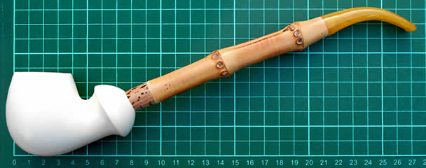 A unique extra-long Meerschaum Hand-carved, large bowl; Bamboo stem fitted to the bowl with a cork attachment